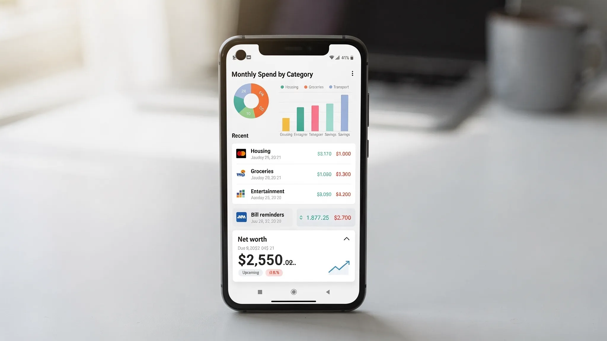 Best Budget App Android: Picks That Sync and Stay Simple 2 An Android smartphone showing a clean budgeting dashboard with monthly spend by category, recent transactions, bill reminders, and a net worth summary card.